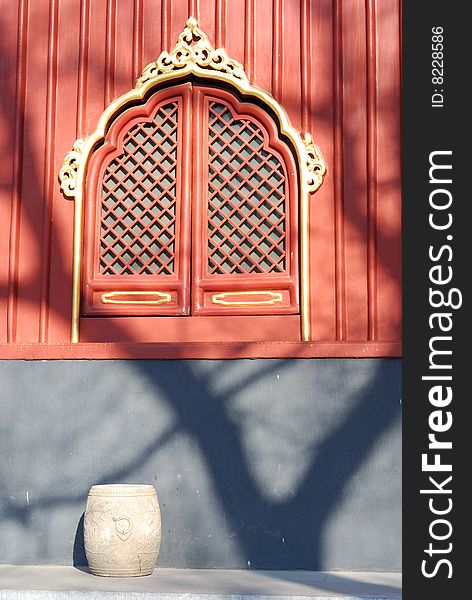 At the noon, a warm light from the sun was shining the window of YongHeGong (The Lama Temple). At the noon, a warm light from the sun was shining the window of YongHeGong (The Lama Temple).