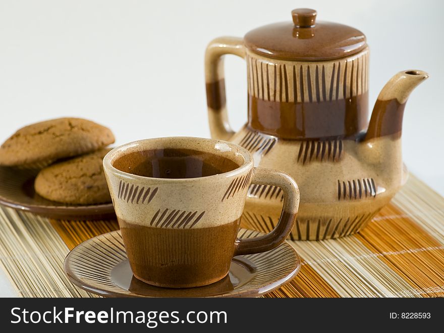 Coffee-pot, cup and biscuit on the table. Coffee-pot, cup and biscuit on the table