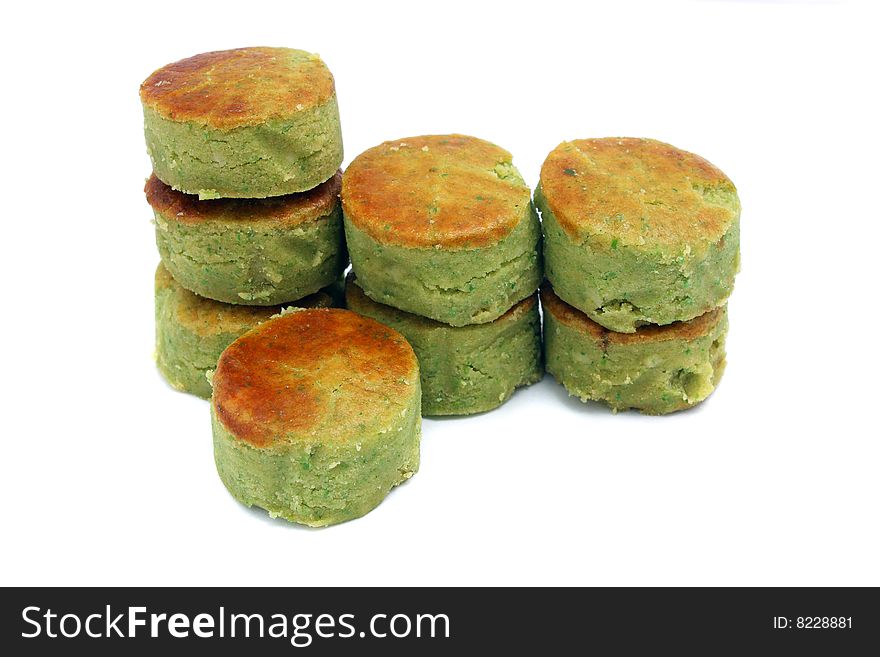 Many mung bean cakes stacked over white background.