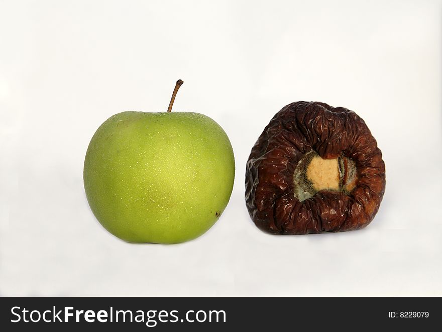 Photo of fresh green and red rotten apples. Photo of fresh green and red rotten apples