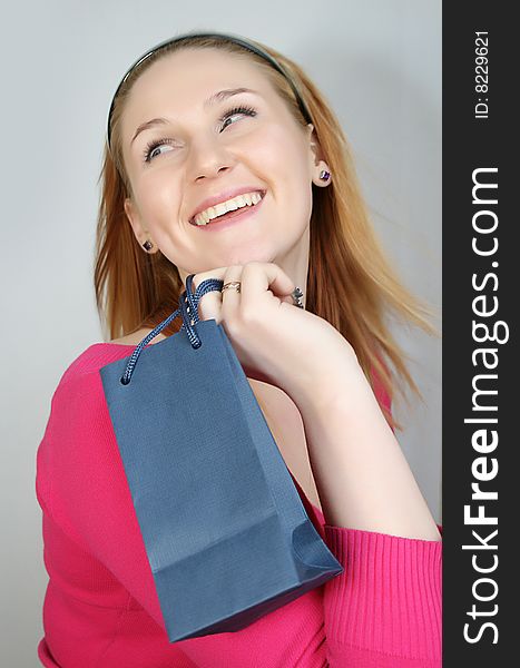 Beautiful smiling young woman with shopping, gift bag. Beautiful smiling young woman with shopping, gift bag