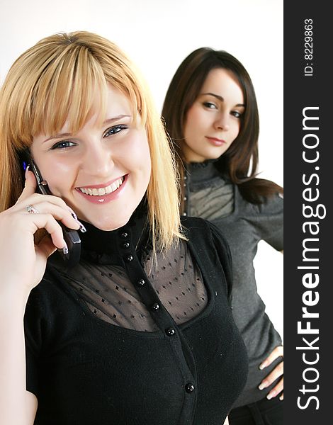 Businesswoman holding mobile phones. focus in on the front model.