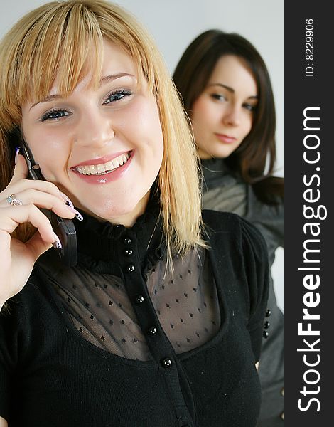 Businesswoman holding mobile phones. focus in on the front model.