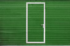 Simple Door In Colored Wall Royalty Free Stock Images