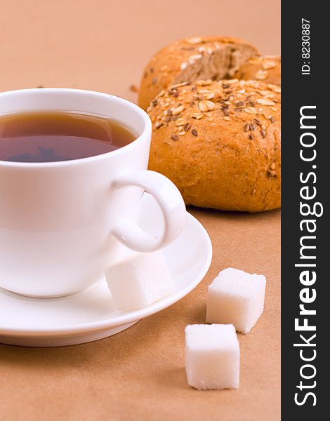 Cup of tea, sugar and bread