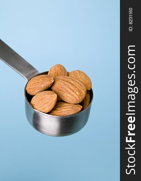 Almonds with blue background