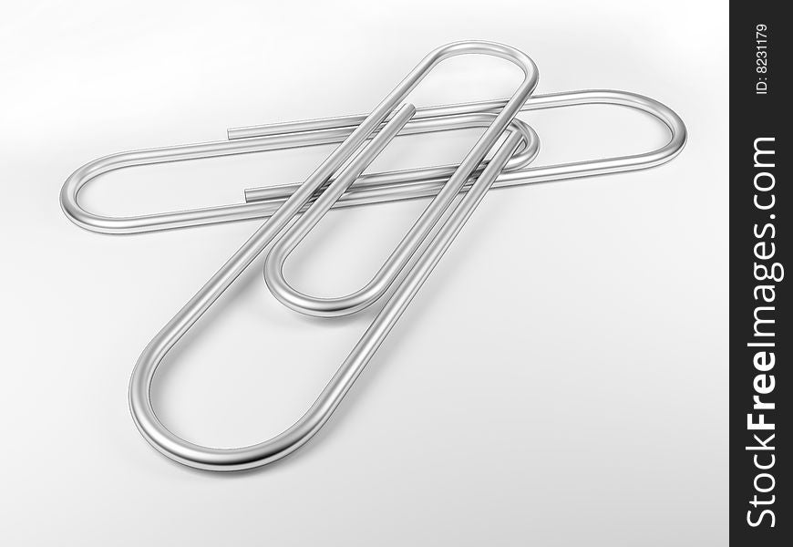 2 paper clips on white plane