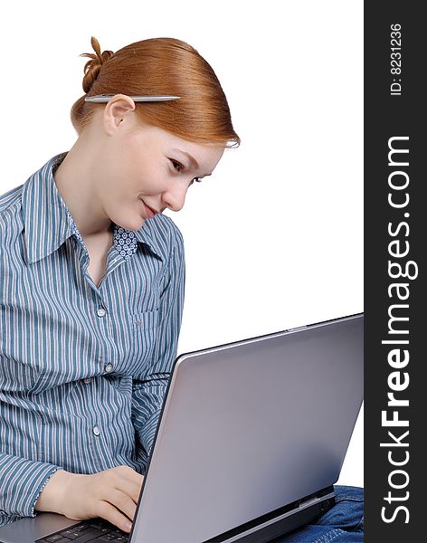 Young business woman with the laptop on a white background