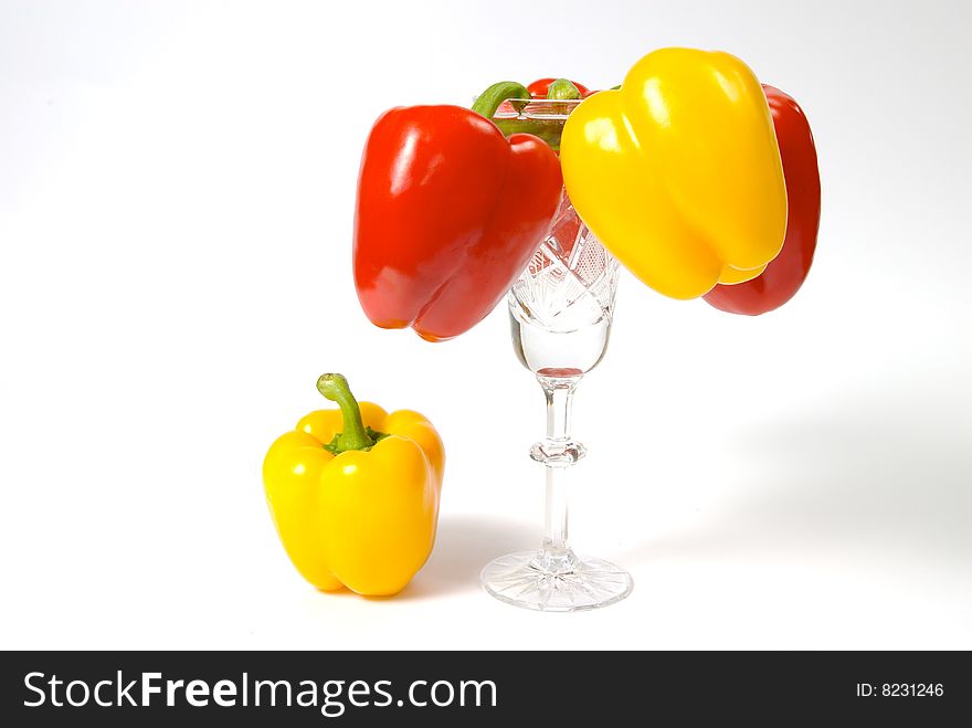 Yellow and red peppers in goblet; fifth unnecessary; place under sun