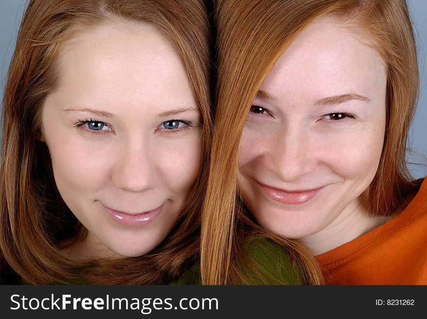 Portrait of two redhead smiling young woman. Portrait of two redhead smiling young woman