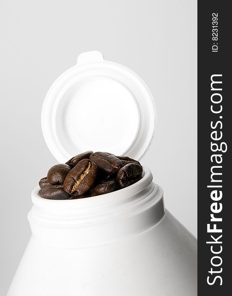 Image of medicine container with coffee beans