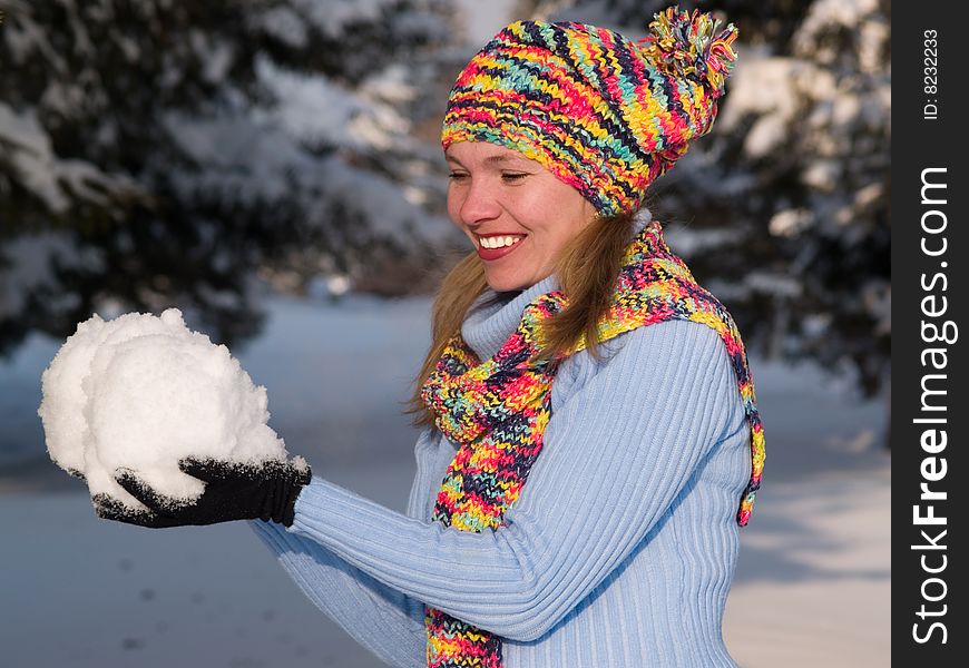 Girl keeps in hand snowball. Girl keeps in hand snowball