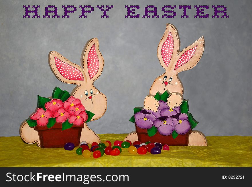 An Easter picture with two little wooden bunnies I made from wood, with easter sweets. An Easter picture with two little wooden bunnies I made from wood, with easter sweets.