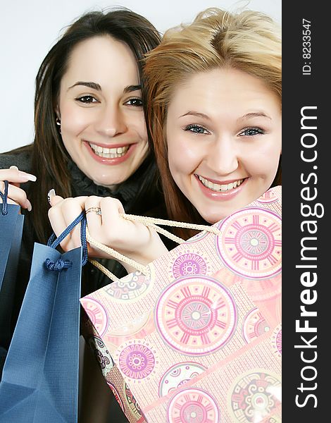 Two beautiful smiling young woman with shopping, gift bag. Two beautiful smiling young woman with shopping, gift bag