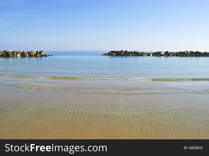 Beach with a stone wall, Adriatic sea, Italy