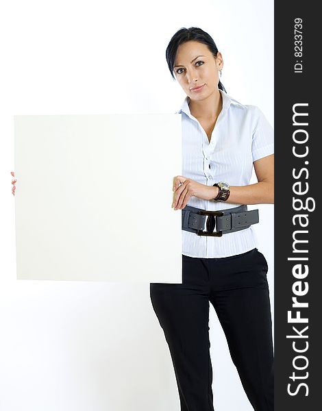 Attractive businesswoman holding a blank board