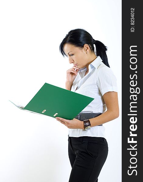 attractive businesswoman holding a folder and reading