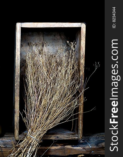 Stock photo: an image of a broom of dry grass in a wooden box