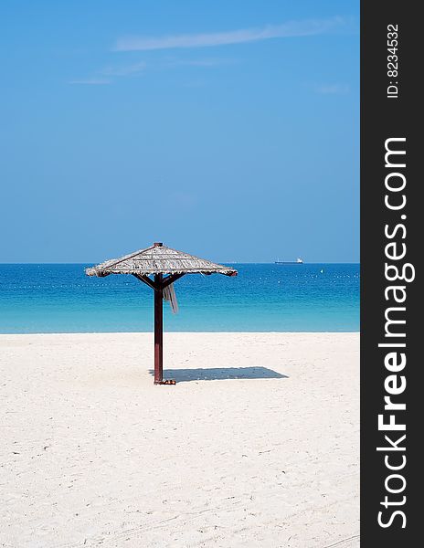 Beach with single hut and clothing