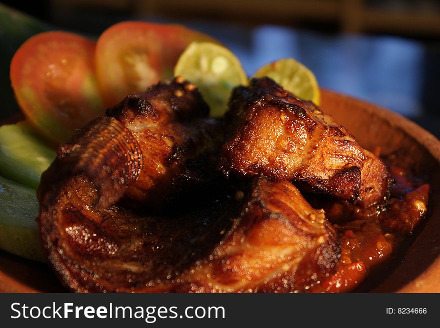 Deep fried Fish served with fresh vegetable and chili paste