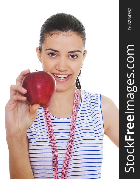 Portrait of cute young woman holding red apple and measuring tape. Portrait of cute young woman holding red apple and measuring tape