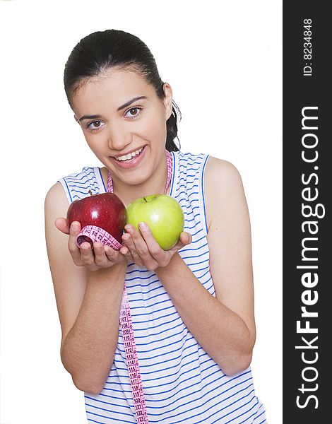 Portrait of cute young woman holding two apples and measuring tape. Portrait of cute young woman holding two apples and measuring tape