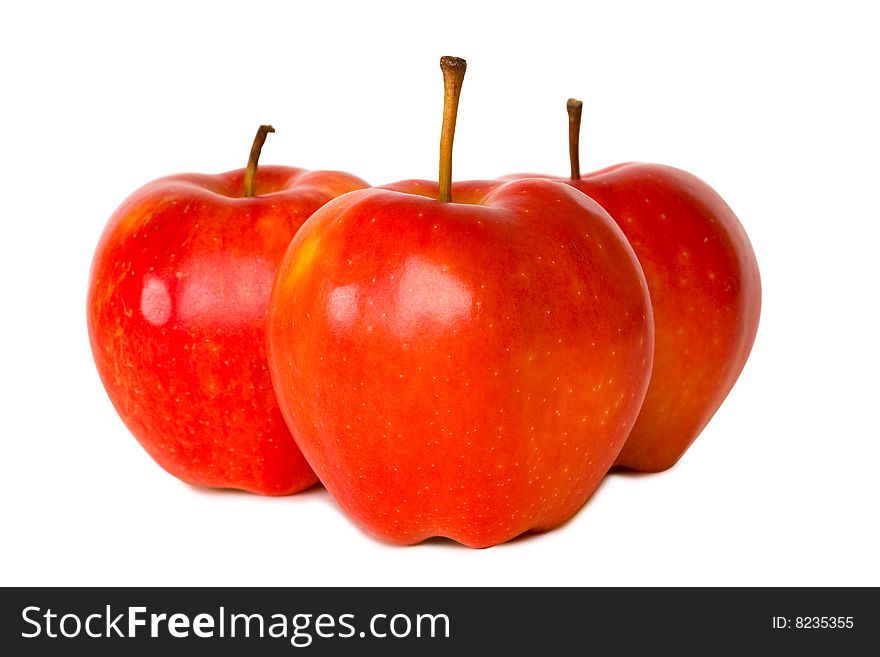 Three red apples isolated on white background