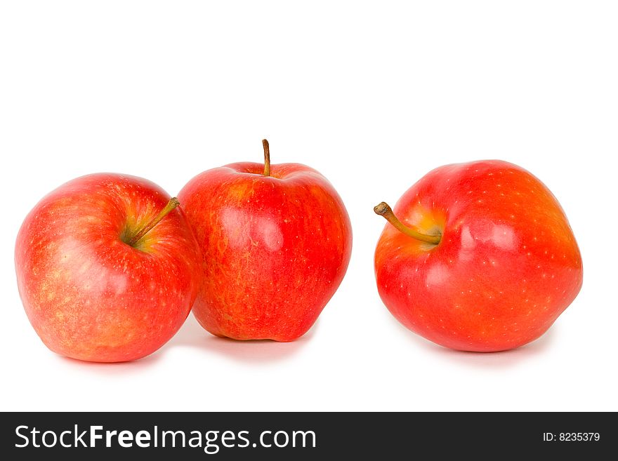 Three red apples isolated on white background