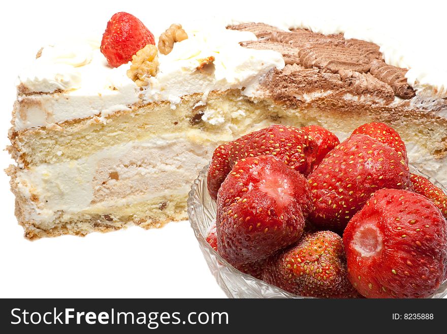 Cream cake with strawberry glaze and berries.