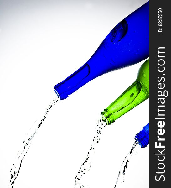 Bottle with Splashing water. Coolness Drink. Bottle with Splashing water. Coolness Drink