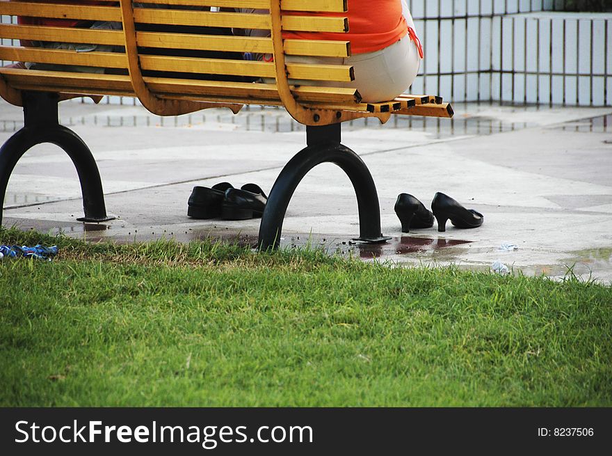 People sitting on a bench in china. People sitting on a bench in china