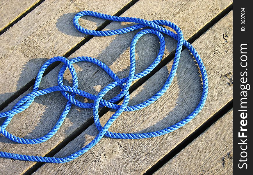 Blue rope on a wooden dock