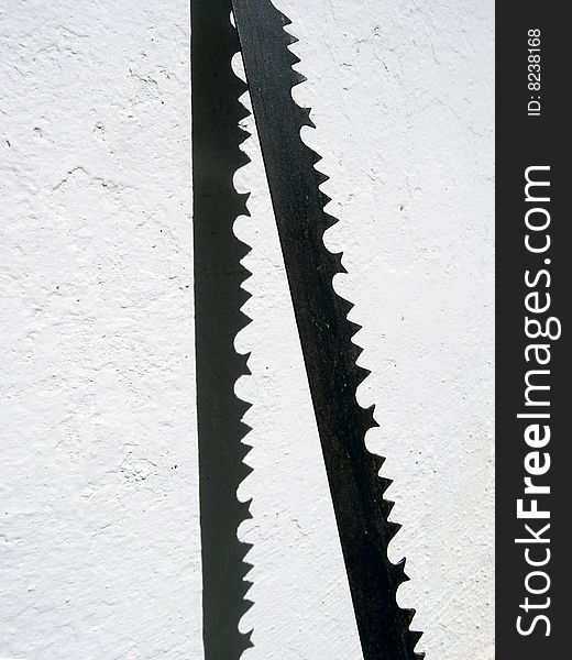 Blade of a saw with its shadow