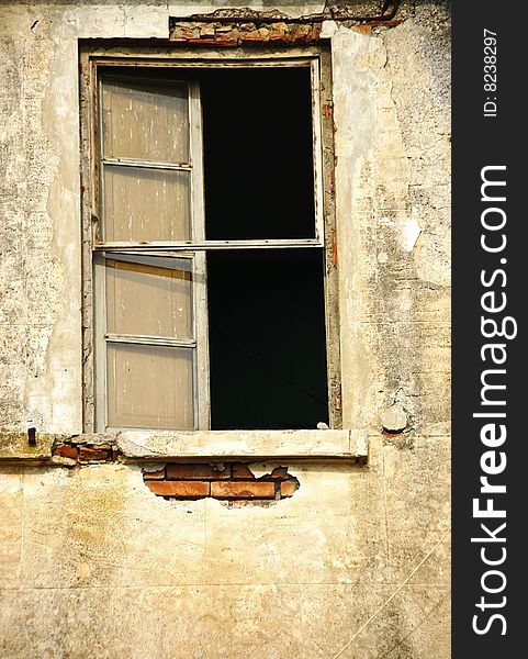 Broken window of an abandoned house