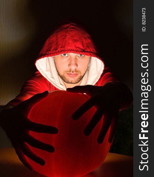 Awesome man holds ball of light in his hands. Awesome man holds ball of light in his hands