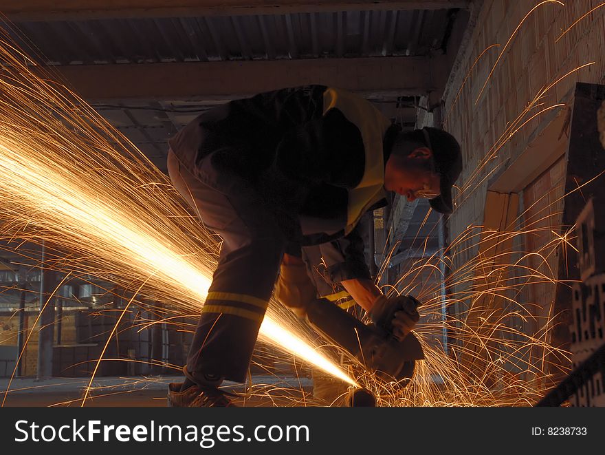 The flame of sparks during construction of one of the city buildings. The flame of sparks during construction of one of the city buildings.