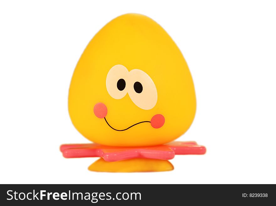 Yellow toy on the white background