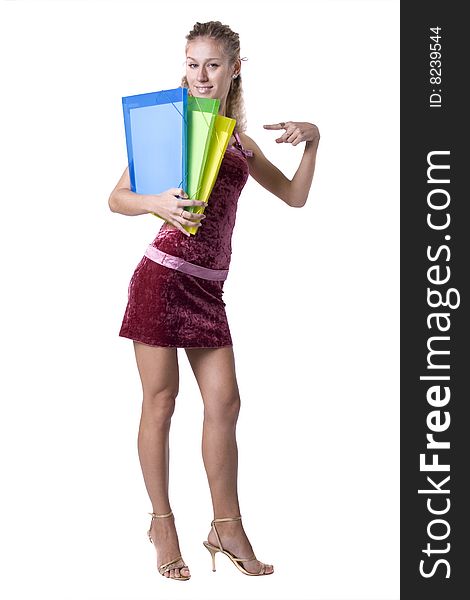 The young beautiful businesswoman at office behind work on a white background. The young beautiful businesswoman at office behind work on a white background