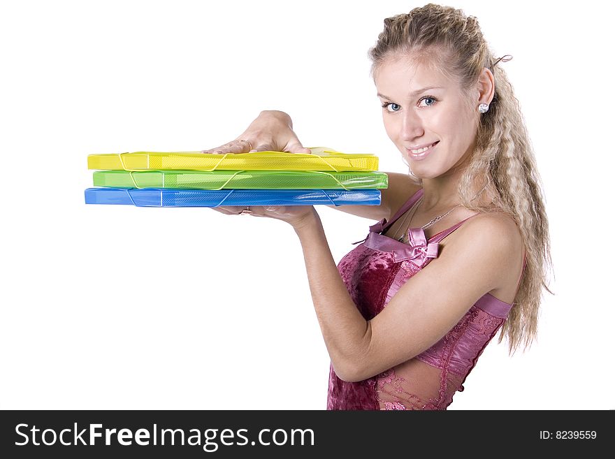 The young beautiful businesswoman at office behind work on a white background. The young beautiful businesswoman at office behind work on a white background