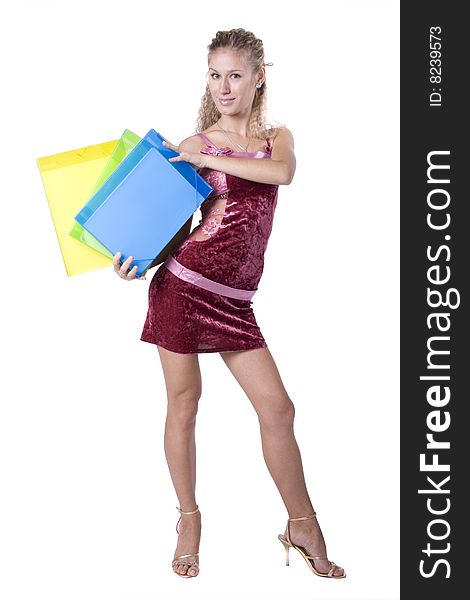 The young beautiful businesswoman at office behind work on a white background. The young beautiful businesswoman at office behind work on a white background