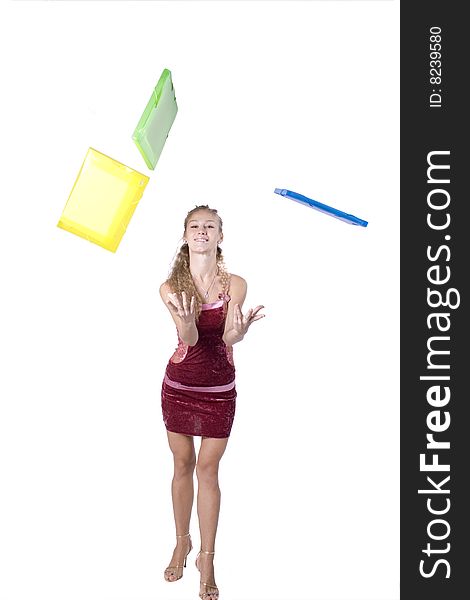 The young beautiful businesswoman at office behind work on a white background. The young beautiful businesswoman at office behind work on a white background