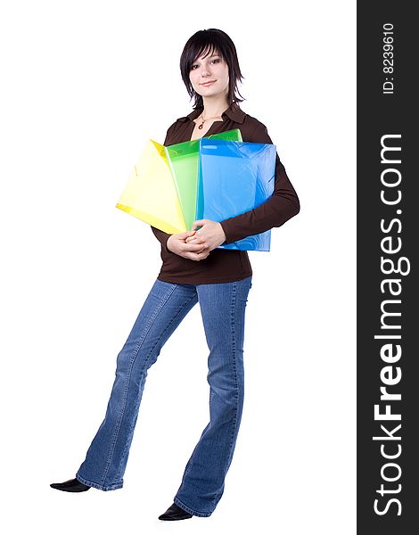 The young beautiful businesswoman at office behind work on a white background. The young beautiful businesswoman at office behind work on a white background