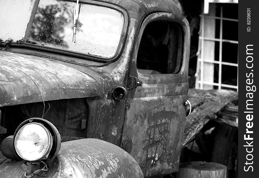 Old truck left to deteriorate slowly siting by the wayside slowly rusting away. Old truck left to deteriorate slowly siting by the wayside slowly rusting away.