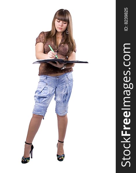 The young beautiful businesswoman at office behind work on a white background. The young beautiful businesswoman at office behind work on a white background