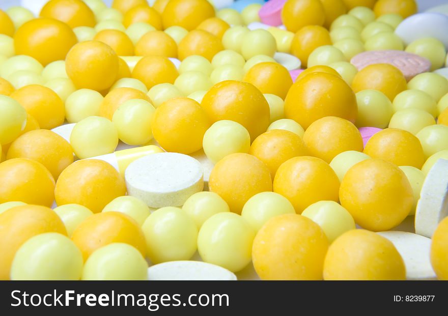 Close - up orange tablets of vitamines.