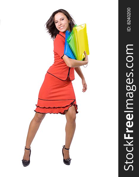 The young beautiful businesswoman at office behind work on a white background. The young beautiful businesswoman at office behind work on a white background