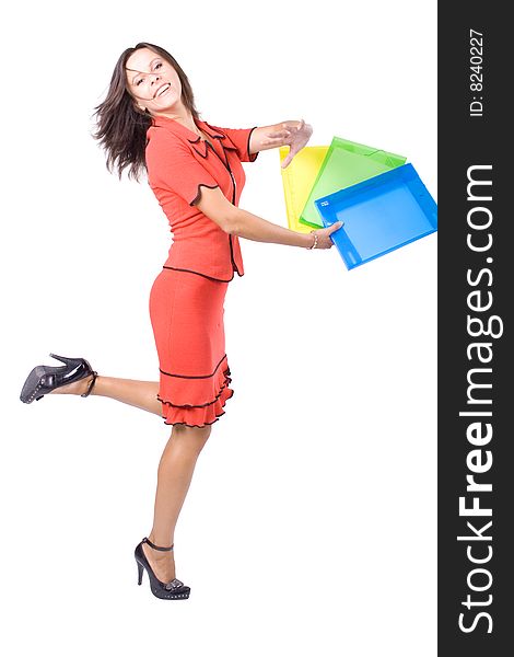 The young beautiful businesswoman at office behind work on a white background. The young beautiful businesswoman at office behind work on a white background