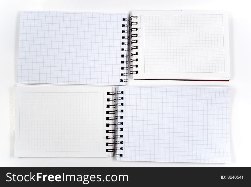 Four opposite notebook with spiral on white