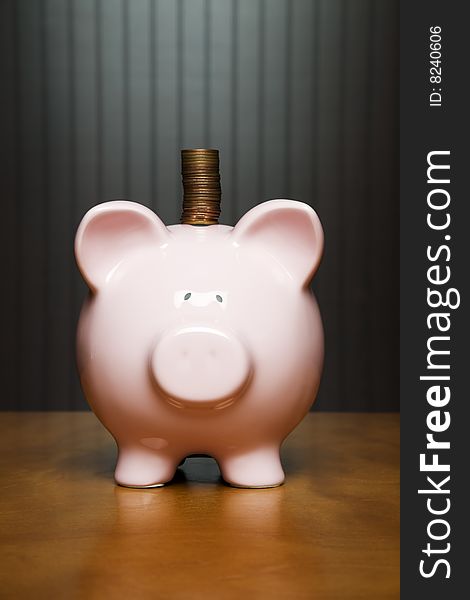 Stack of pennies placed on a Piggy bank. Stack of pennies placed on a Piggy bank