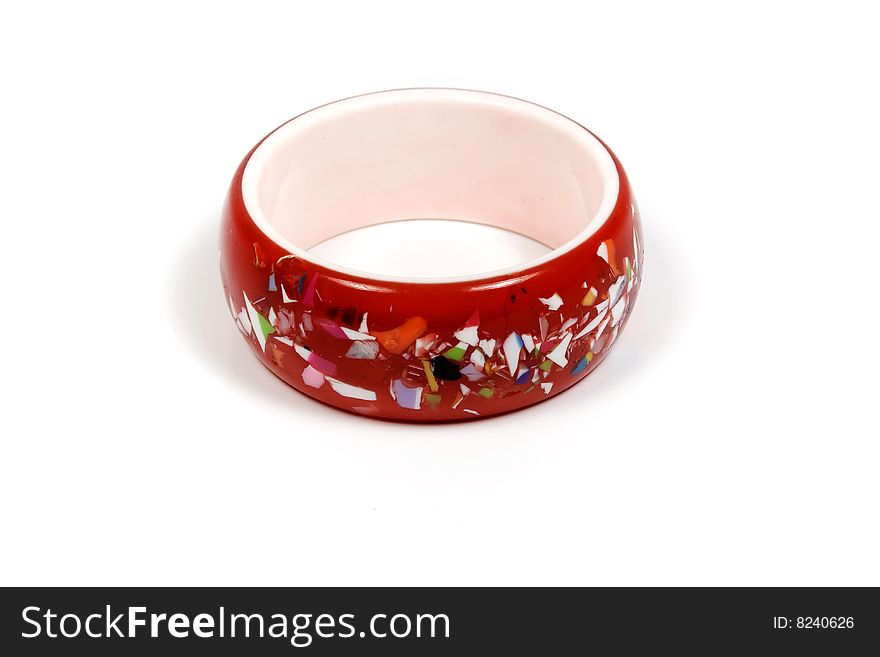 Red bracelet with abstract decoration on white